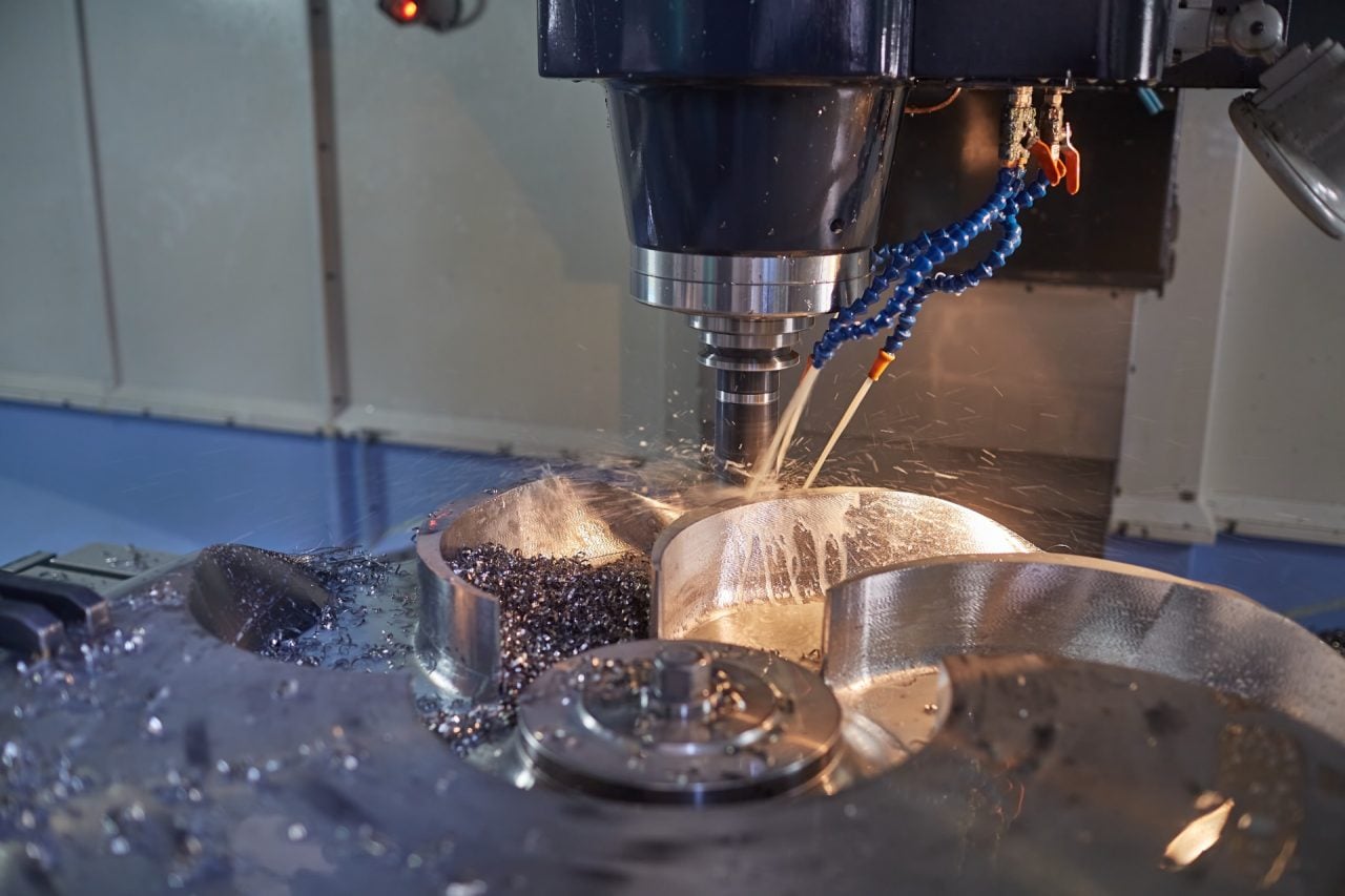 CNC milling machine cutting a metal part — CheMost metalworking fluid additives