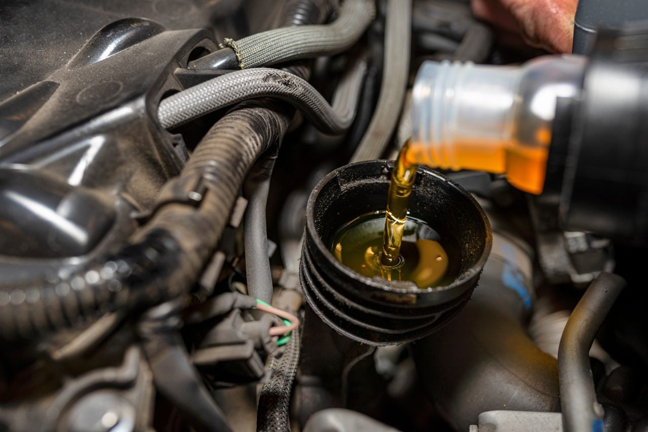 Engine oil poured into an engine — CheMost engine oil additive packages (PCMO / HDDO / motorcycle)